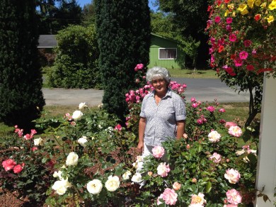 Donna in her garden. I wish you could see it all! She is ruthless in trimming, which makes her roses bloom prolifically! 