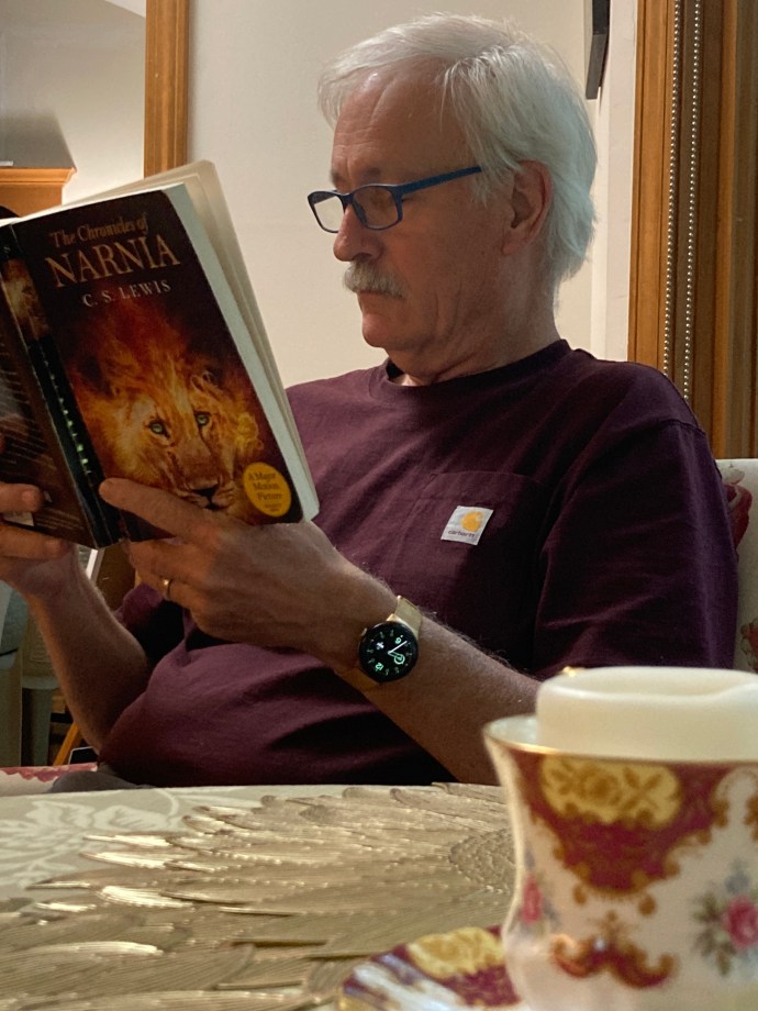 Paul reading to his wife.